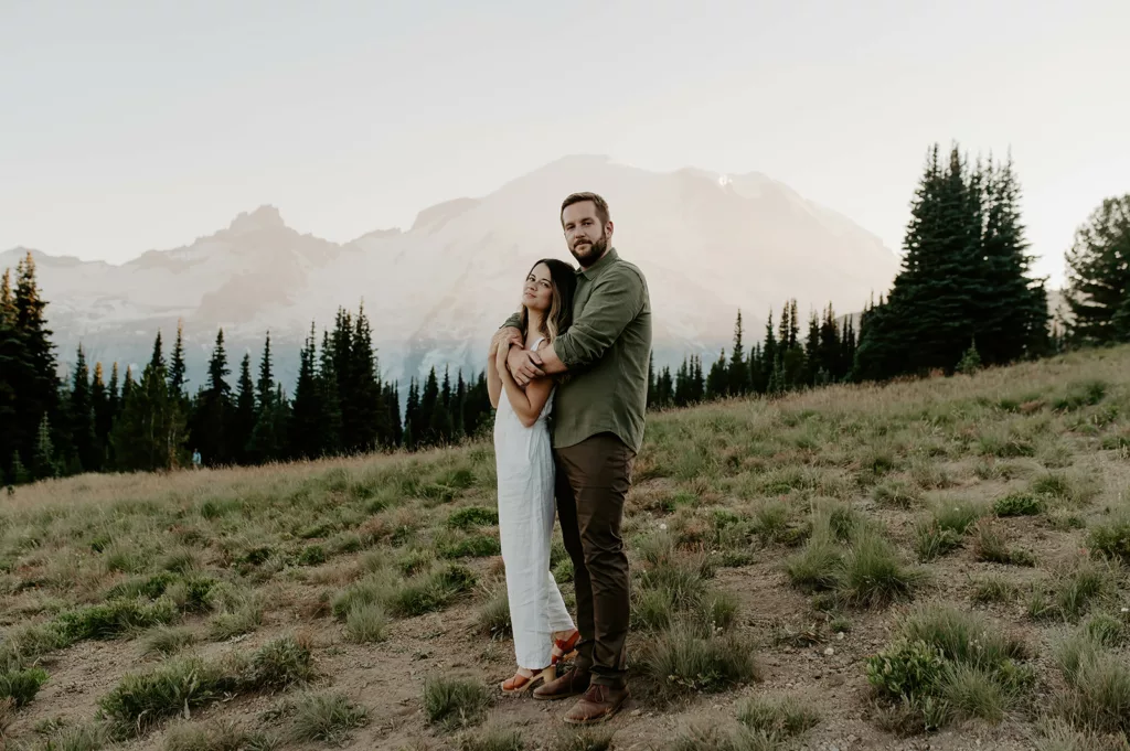 men carrying his fiancé's and facing the camera