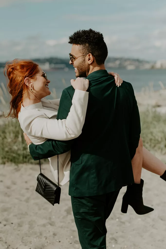 men watching his women in his lap and sharing big smiles