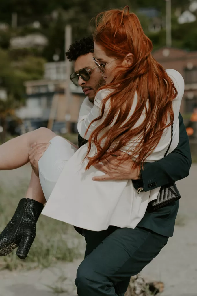 romantic men carrying her women in her lap