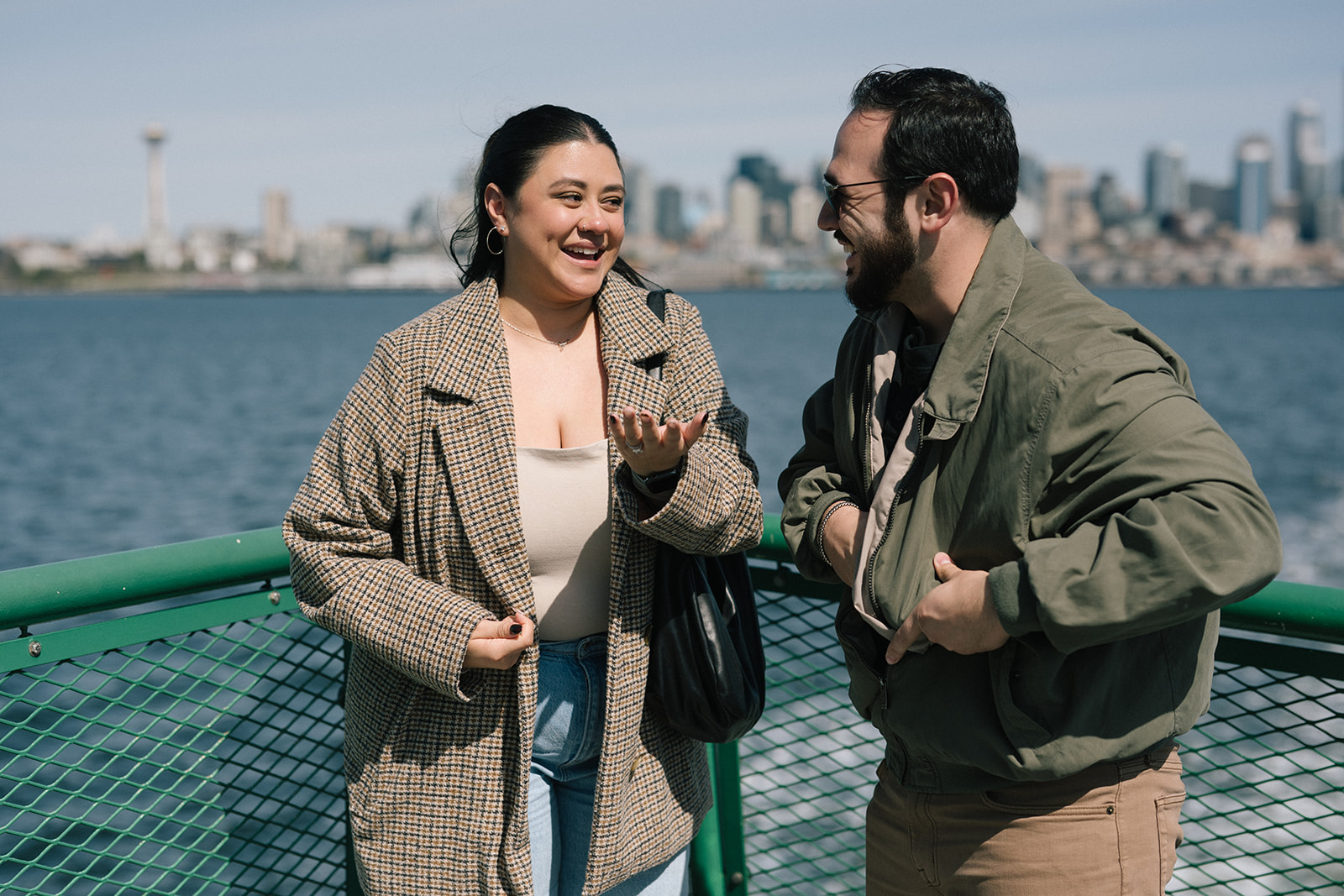 Alyssa and Johnny laughing together with Seattle in the background