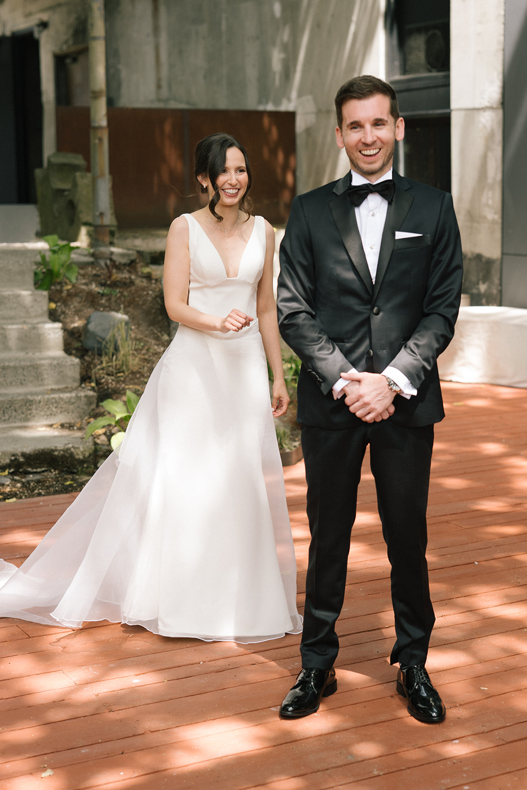 Bride and groom standing together after their first look at a Fremont Foundry wedding in Seattle