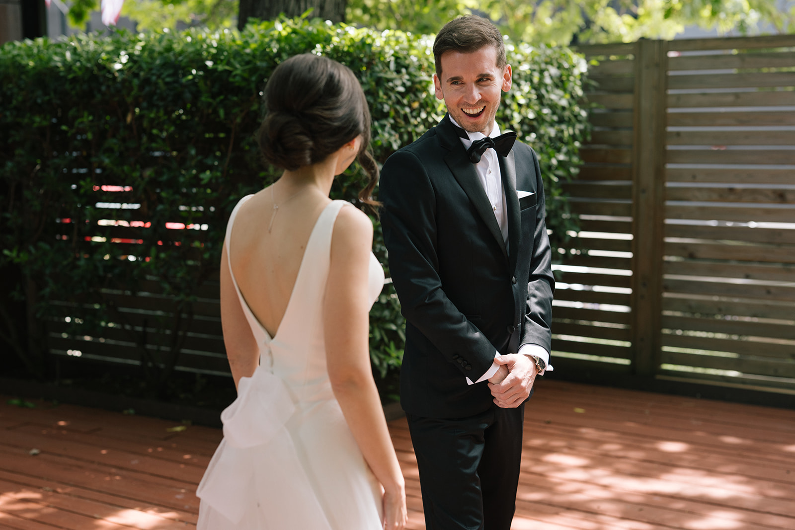 Groom smiling emotionally as he sees his bride during their first look at the Fremont Foundry in Seattle