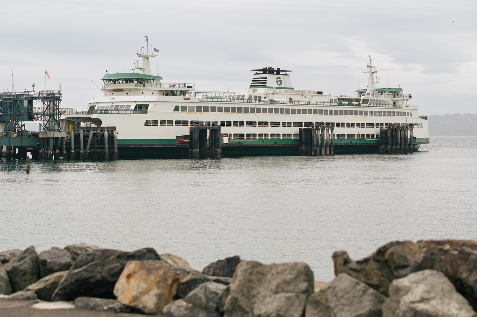 A ferry sits across the water on an overcast day, setting the scene for a Pacific Northwest waterfront proposal.